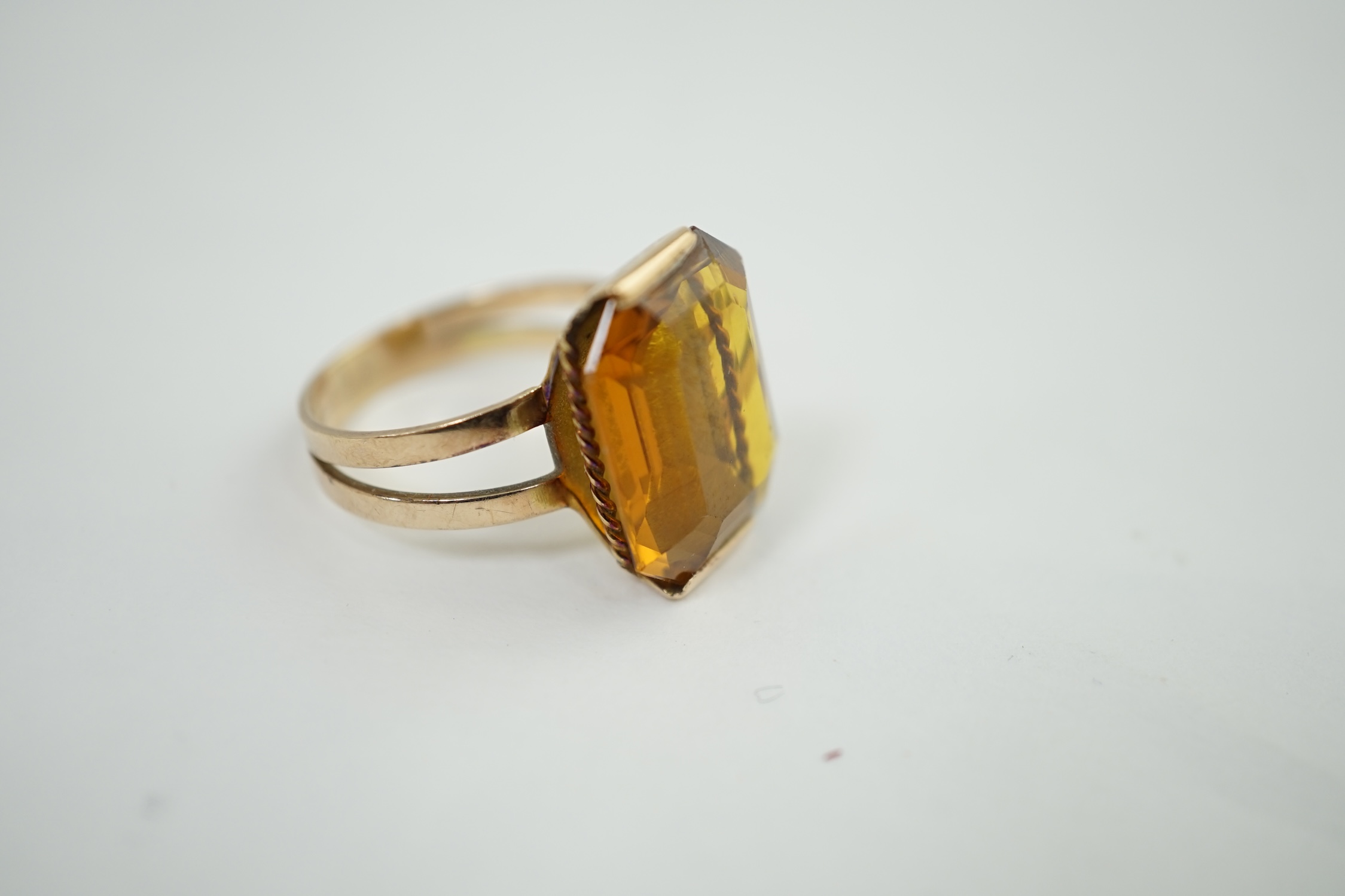 A mid to late 20th century gold and single stone octagonal cut synthetic? sapphire set dress ring